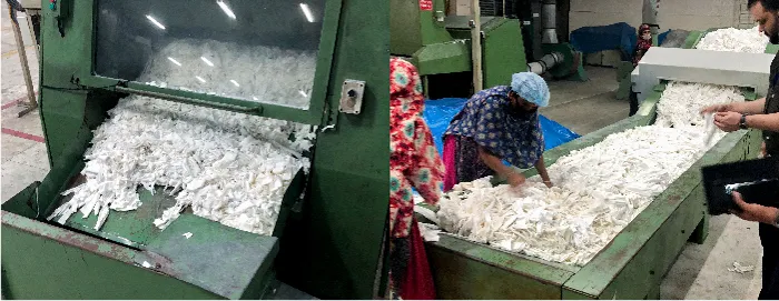 色別に集めた生地を機械で細かく裁断します。